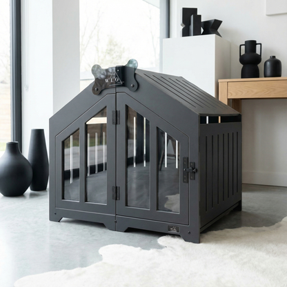 Gray pet crate with glass doors in a modern living room setting