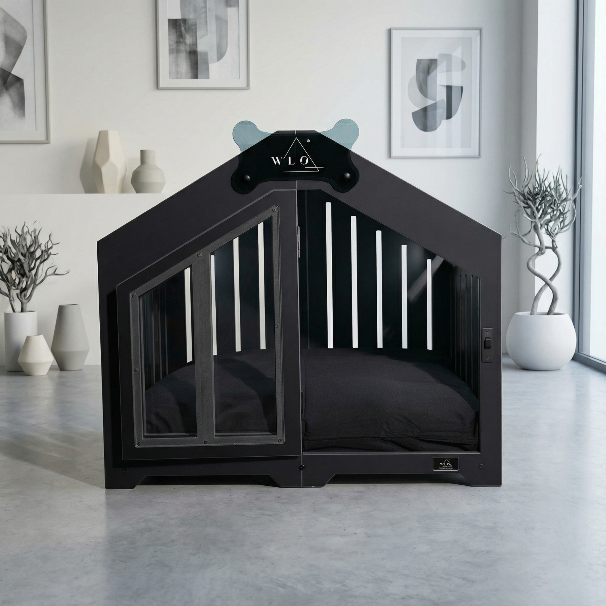 Black pet crate with a cushion inside, branded 'WLO', in a modern room.