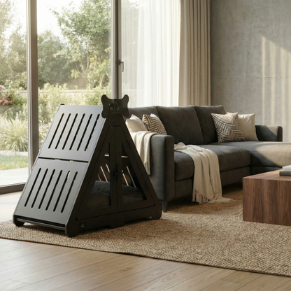 Modern living room with a gray sectional sofa, wooden coffee table, and a pet stand.