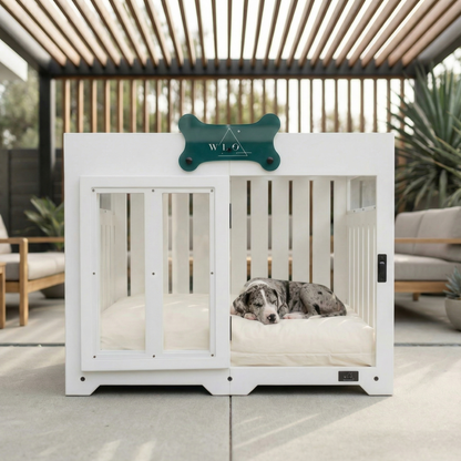 White dog crate with a dog inside, branded 'WLO', on a patio.