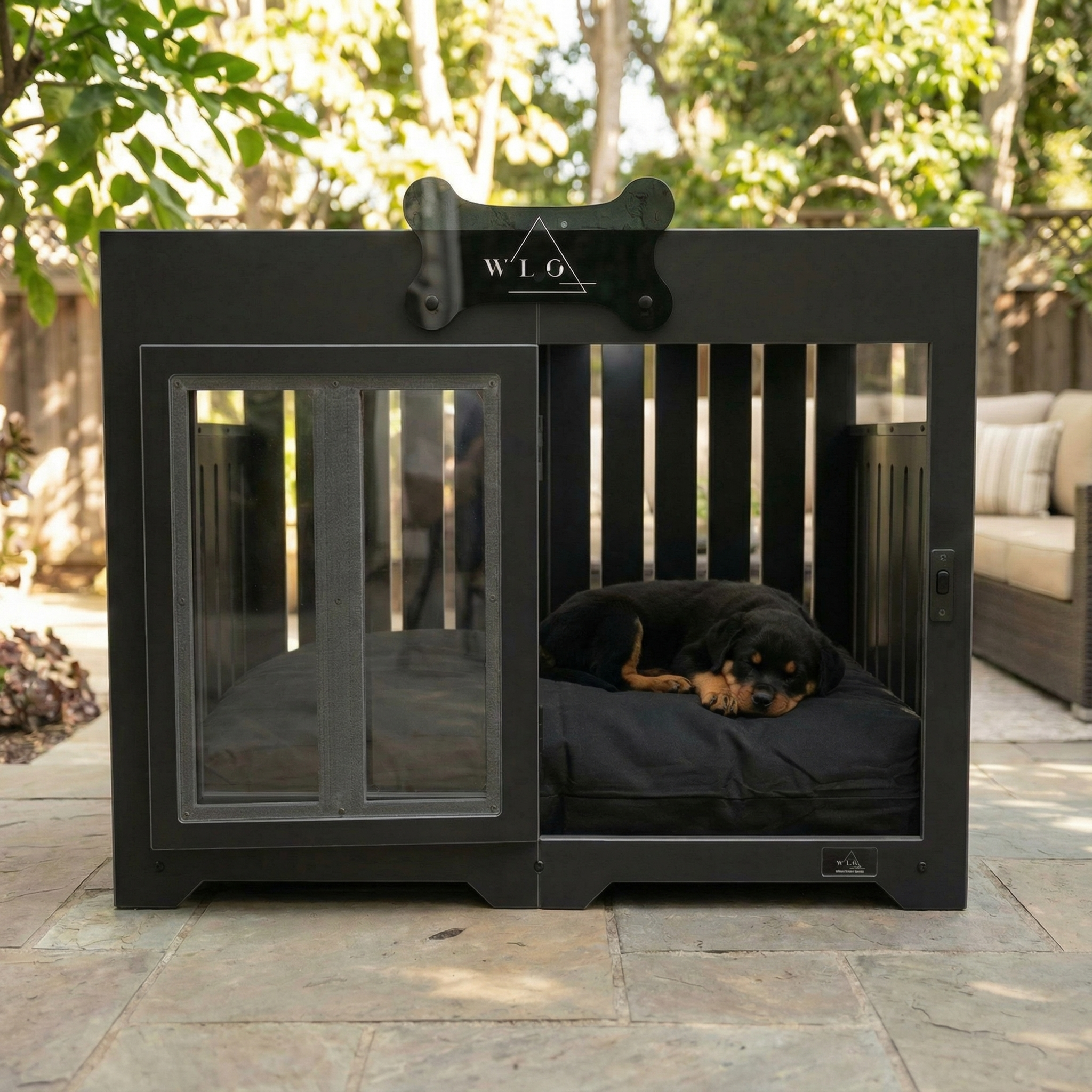 Black pet crate with a dog inside, outdoors on a patio.