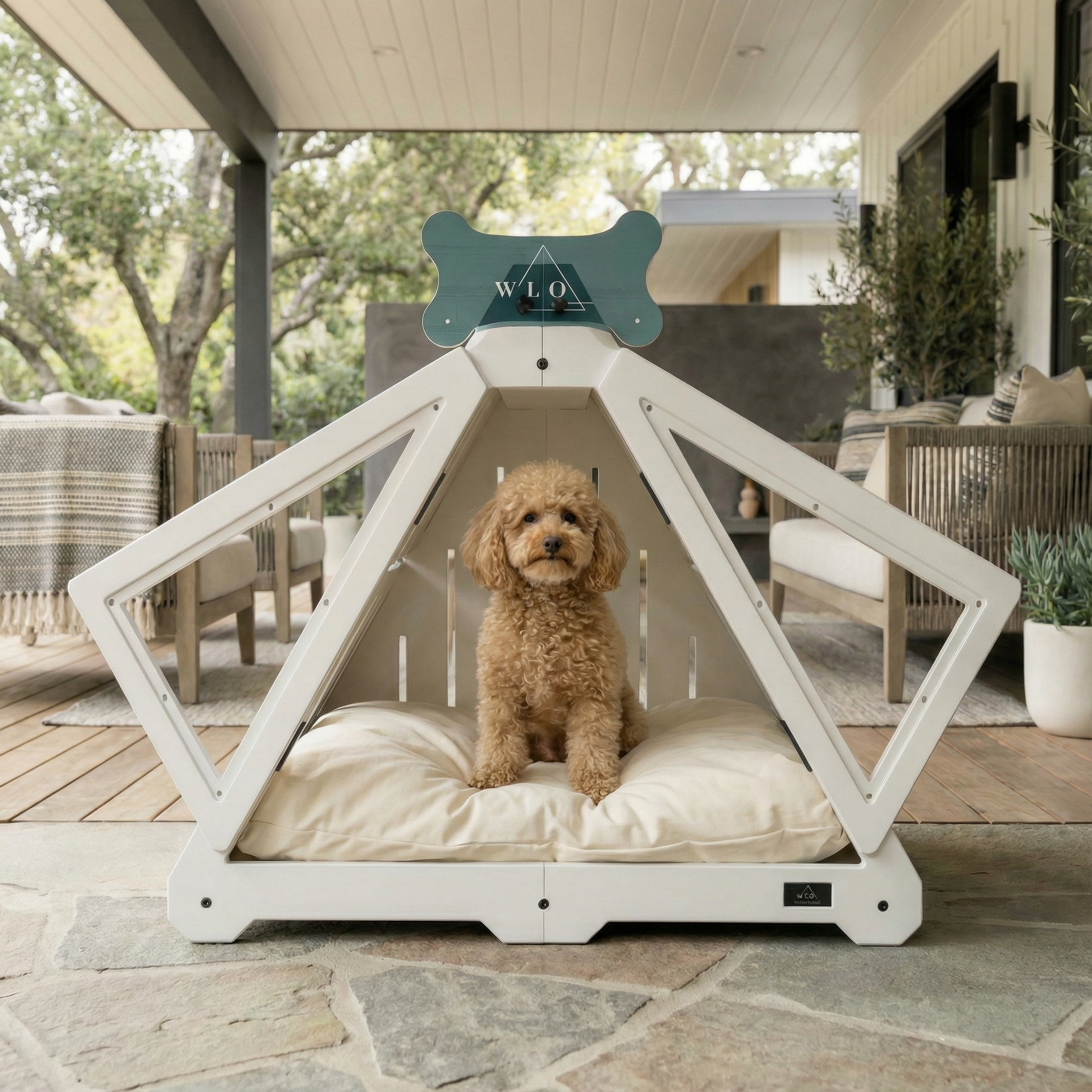 Dog sitting in a white geometric pet bed on a patio