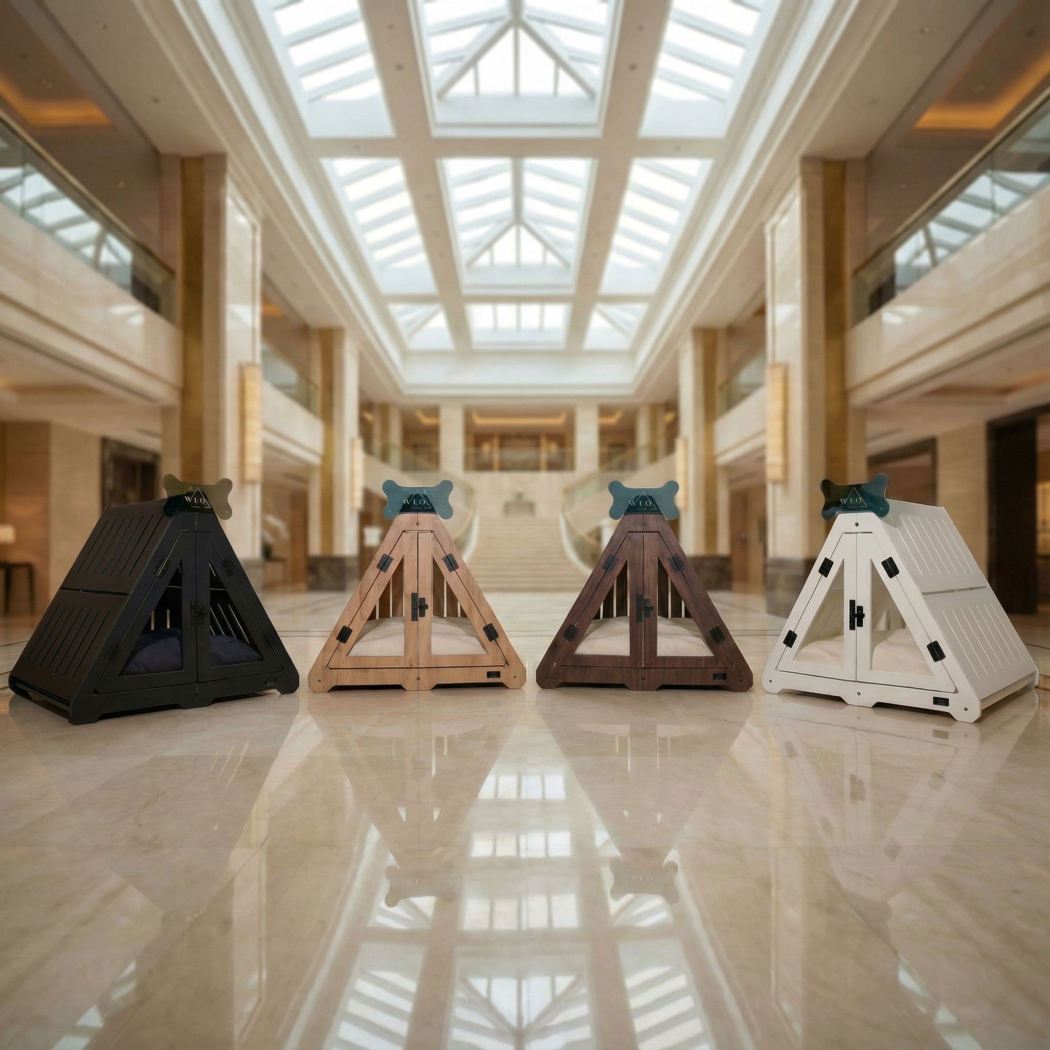 Four triangular stands in black, brown, and white in a large indoor space with high ceilings.