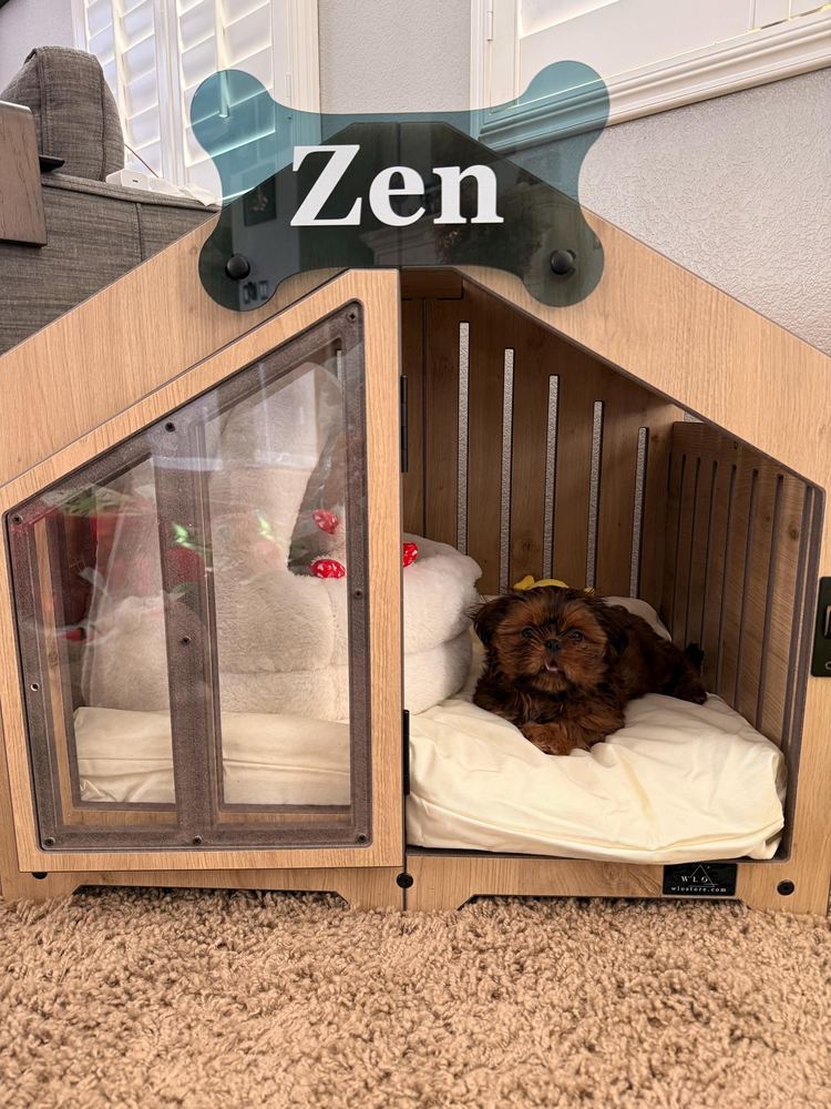 A customer’s Gabled dog house in Natural Oak, Size 1. Customer photo from a review, Feb 2026.