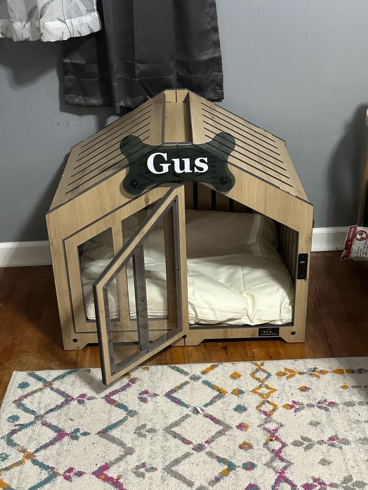 A customer’s Gabled dog house in Natural Oak, Size 1. Customer photo from a review, Feb 2026.