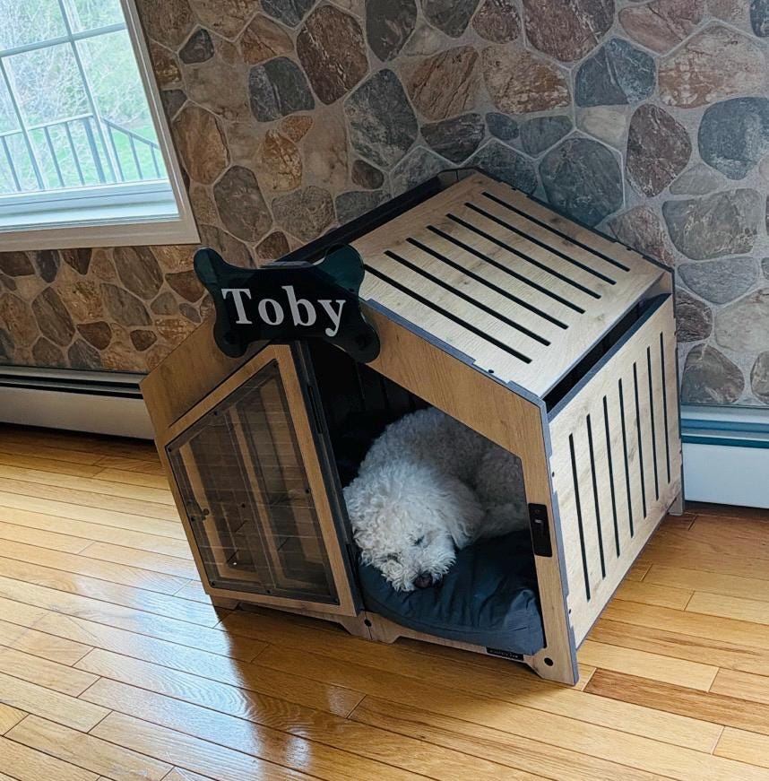 A customer’s Gabled dog house in Natural Oak, Size 1. Customer photo from a review, Apr 2026.