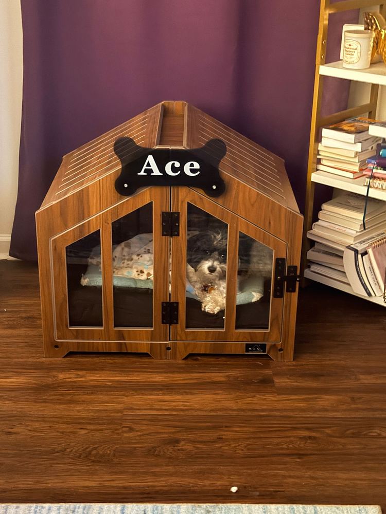 A customer’s Gabled dog house in Classic Walnut. Customer photo from a review, May 2026.