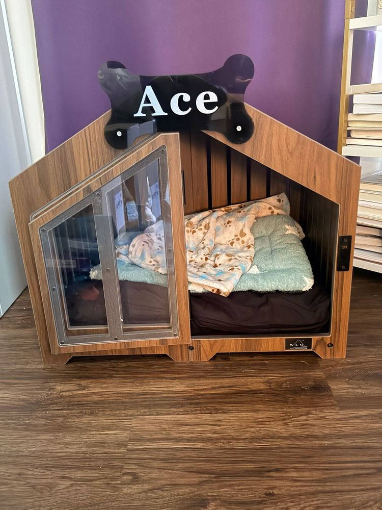 A customer’s Gabled dog house in Classic Walnut. Customer photo from a review, May 2026.