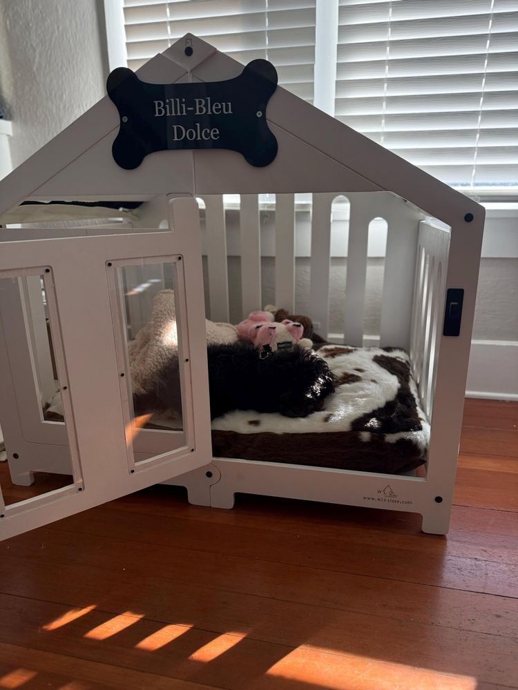 A customer’s Gabled dog house in Pure White, Size 2. Customer photo from a review, Aug 2025.