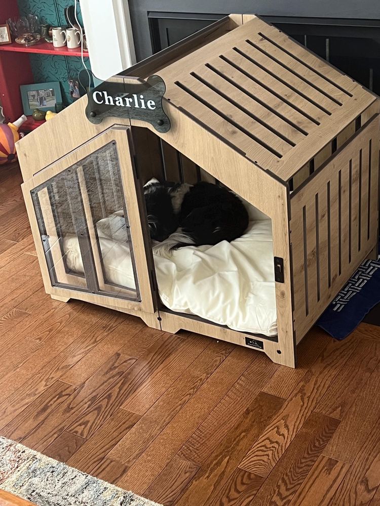 A customer’s Gabled dog house in Natural Oak, Size 2. Customer photo from a review, Mar 2026.
