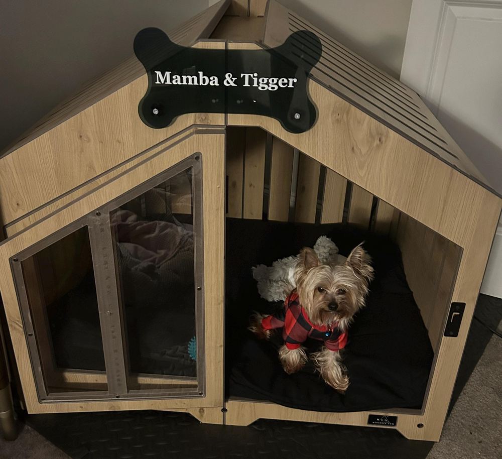 A customer’s Gabled dog house in Natural Oak, Size 2. Customer photo from a review, Jan 2026.