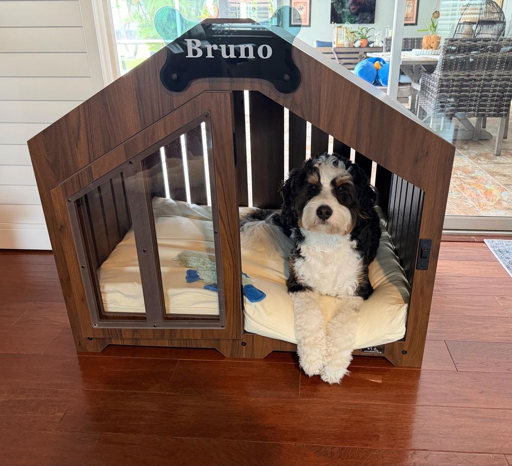 A customer’s Gabled dog house in Classic Walnut, Size 2. Customer photo from a review, Jul 2026.