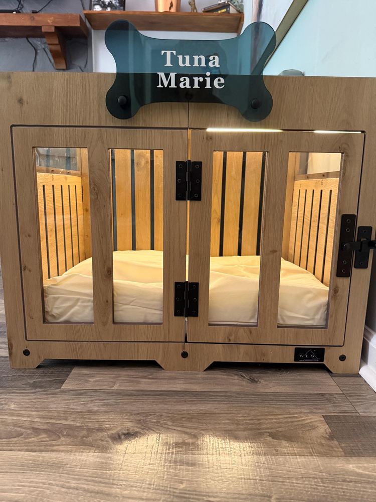 A customer’s Pueblo dog house in Natural Oak, Size 1. Customer photo from a review, Jul 2026.