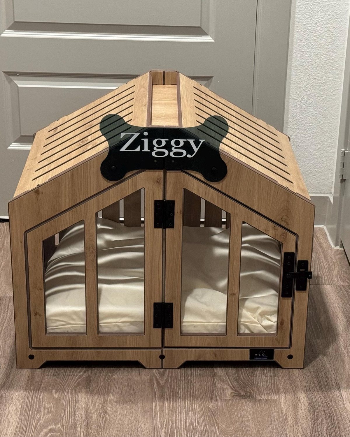 Ziggy, a dog in a Gabled dog house in Natural Oak, Size 2. Customer photo from a review, Nov 2025.
