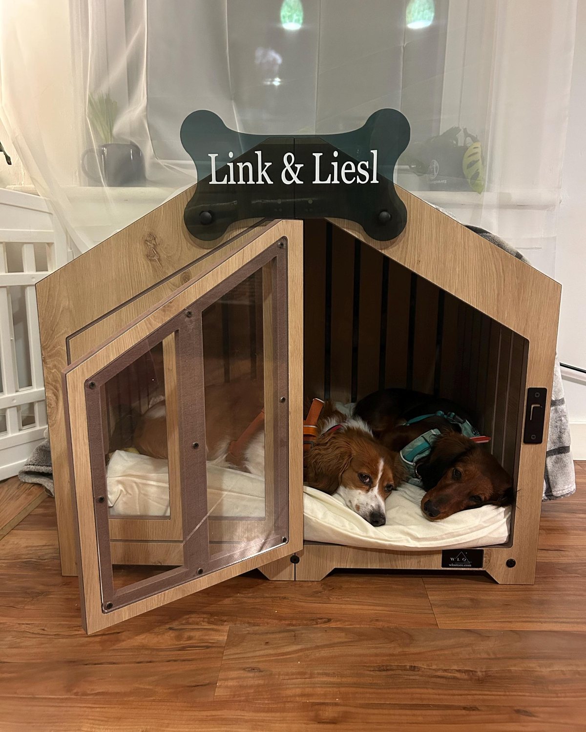 Link & Liesl, a dog in a Gabled dog house in Natural Oak, Size 1. Customer photo from a review, Oct 2025.